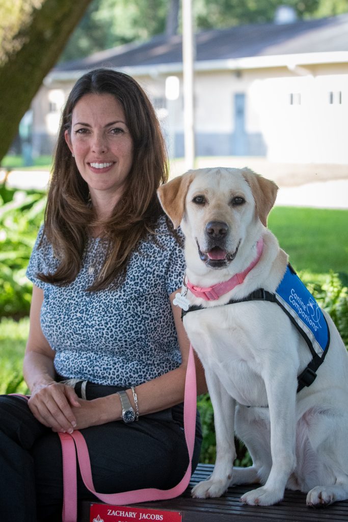 Dr. Ludwig and Hearing Dog Pam. (Photo courtesy Canine Companions)
